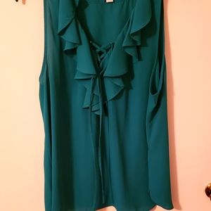 Teal green sheer sleevless top.